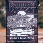 Flag featuring design of a heavy weapons platoon with two vehicles and a mounted .50 caliber gun