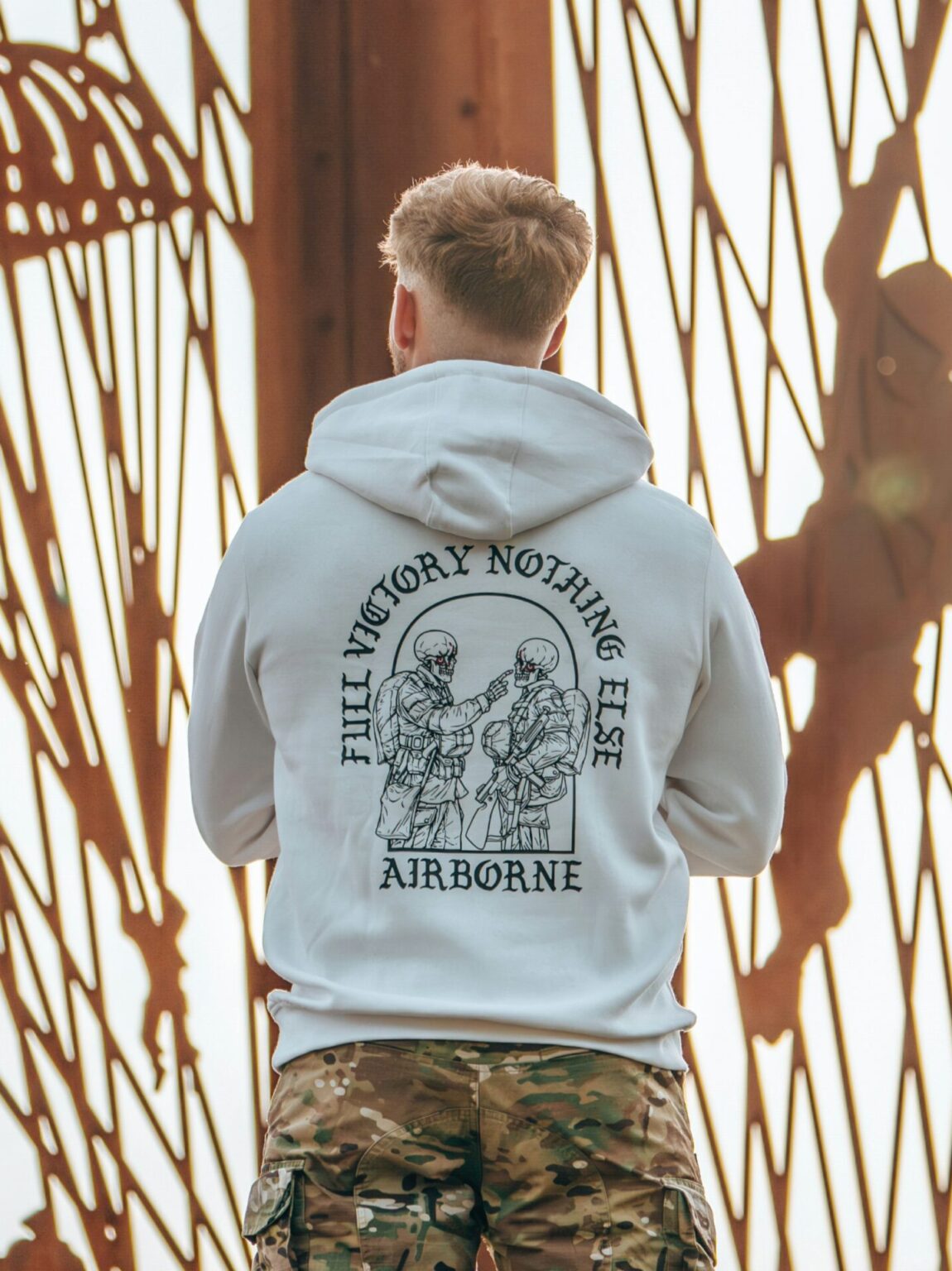 20240903_160659-scaled-1.jpg Hoodie featuring World War II design of two soldiers standing before a parachute jump