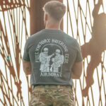 tshirt featuring World War II design of two soldiers standing before a parachute jump