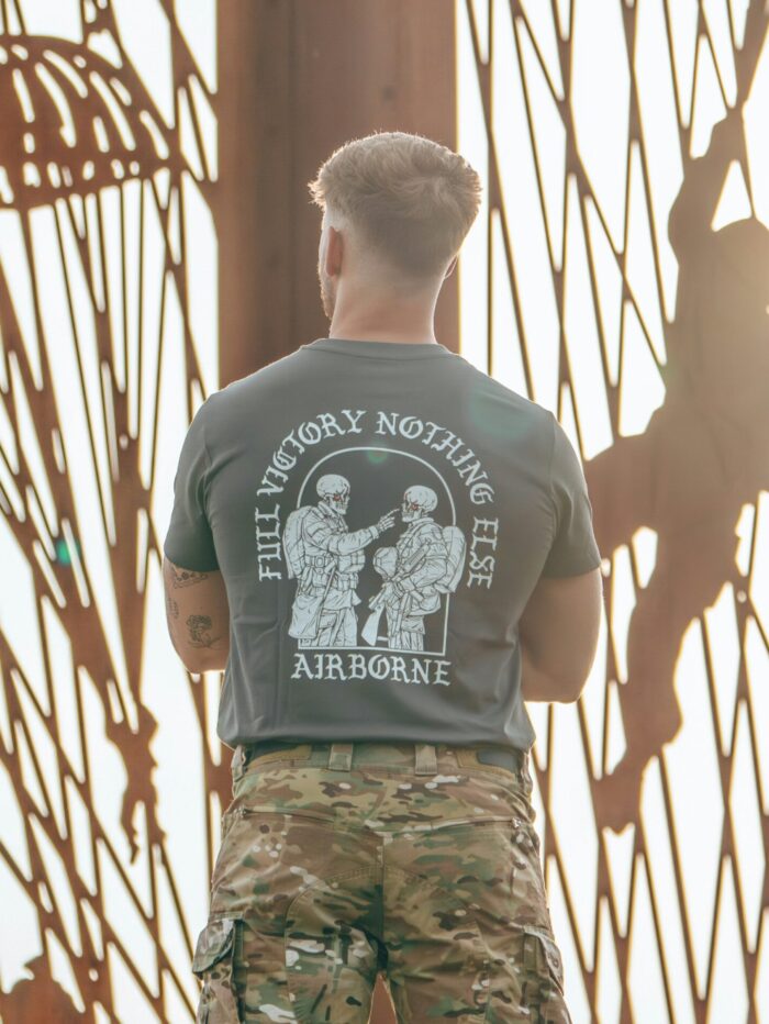 tshirt featuring World War II design of two soldiers standing before a parachute jump