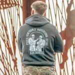 Hoodie featuring World War II design of two soldiers standing before a parachute jump