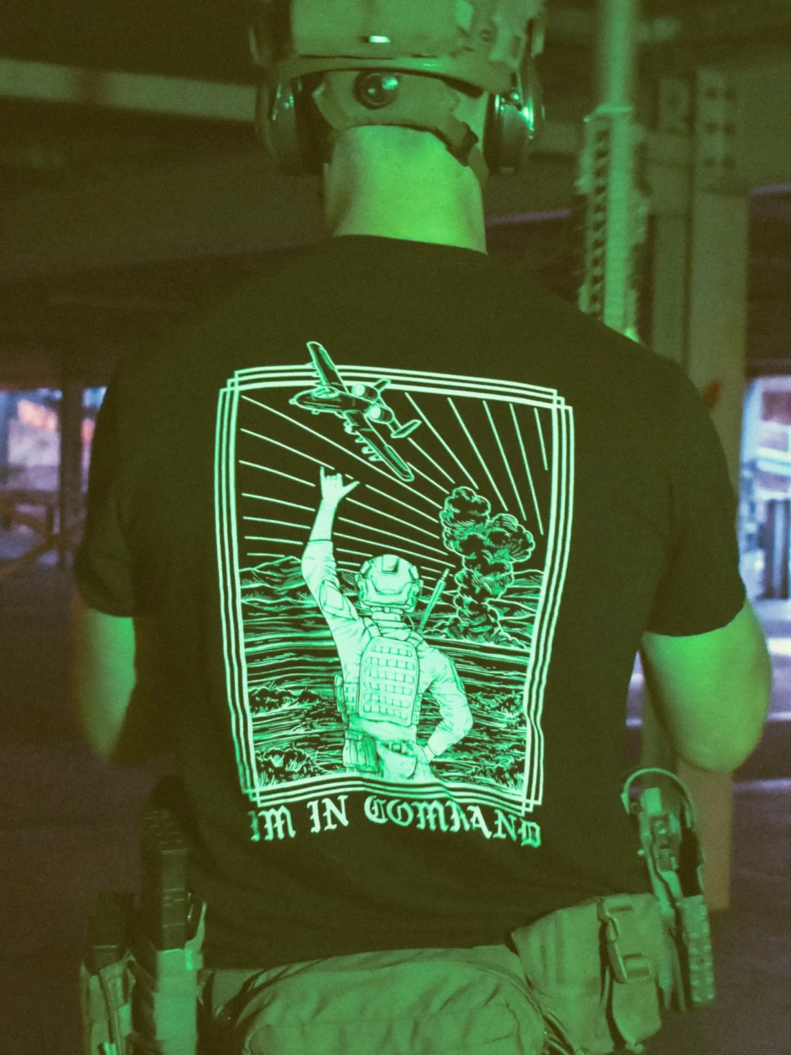 Im-in-command-black-shirt-edit the trace apparel collection featuring a fst jtac guy standing in front of a firing plane