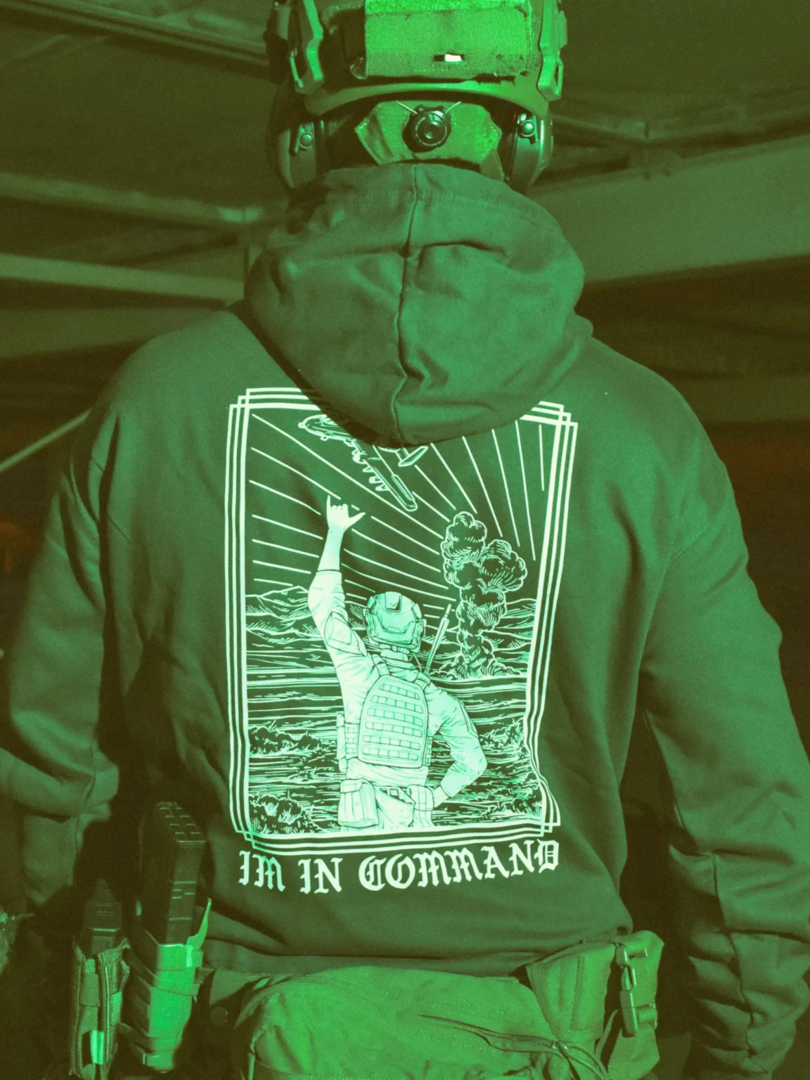 Im-in-command-charcoal-hoodie-edit the trace apparel collection featuring a fst jtac guy standing in front of a firing plane