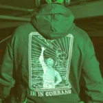 the trace apparel collection featuring a fst jtac guy standing in front of a firing plane