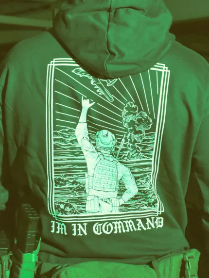 the trace apparel collection featuring a fst jtac guy standing in front of a firing plane