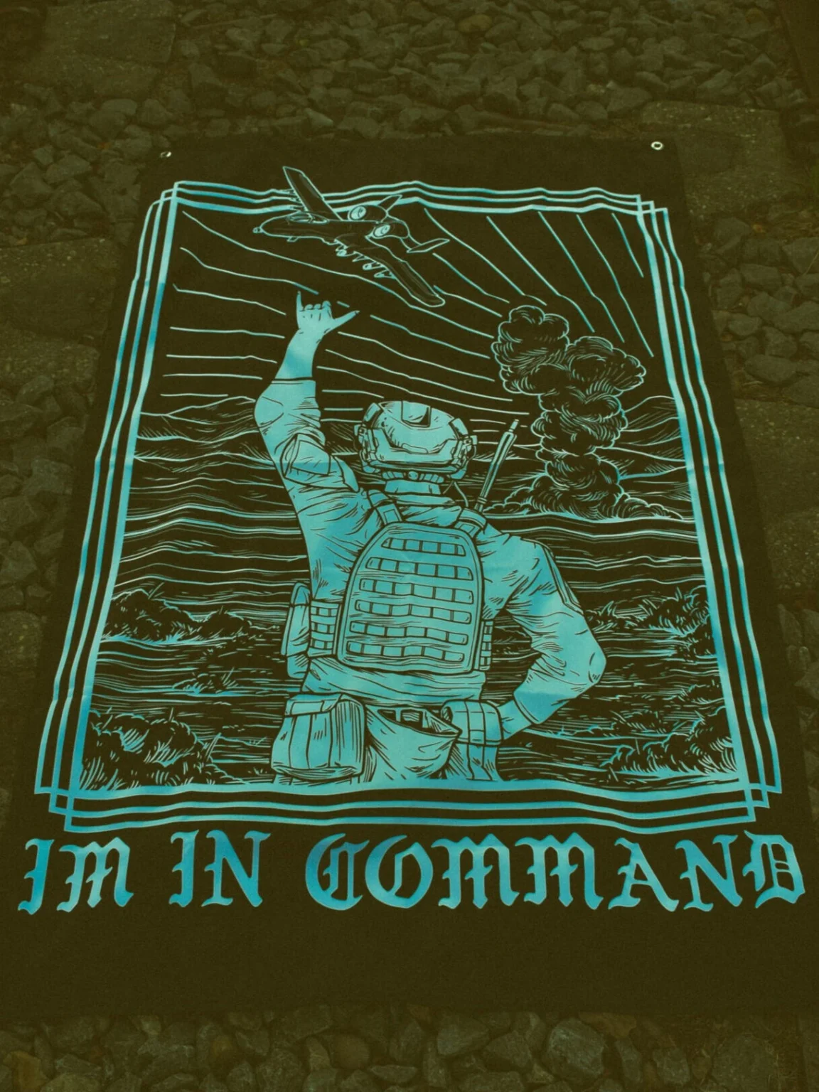 Im-in-command-flag-edit the trace apparel collection featuring a fst jtac guy standing in front of a firing plane
