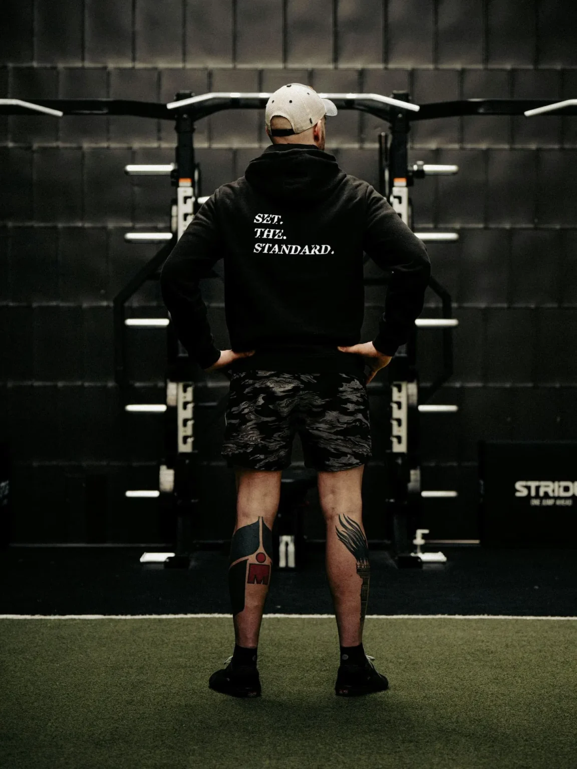Black hoodie from The Trace featuring Set the Standard design symbolizing the pursuit of the highest performance