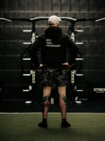 Black hoodie from The Trace featuring Set the Standard design symbolizing the pursuit of the highest performance