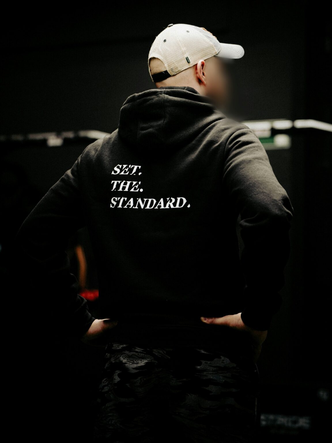 Point Blur_May222025_144152 verkleind Black hoodie from The Trace featuring Set the Standard design symbolizing the pursuit of the highest performance