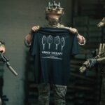 Black tshirt from The Trace featuring Group Therapy design with four targets marked by tight bullet hole groupings