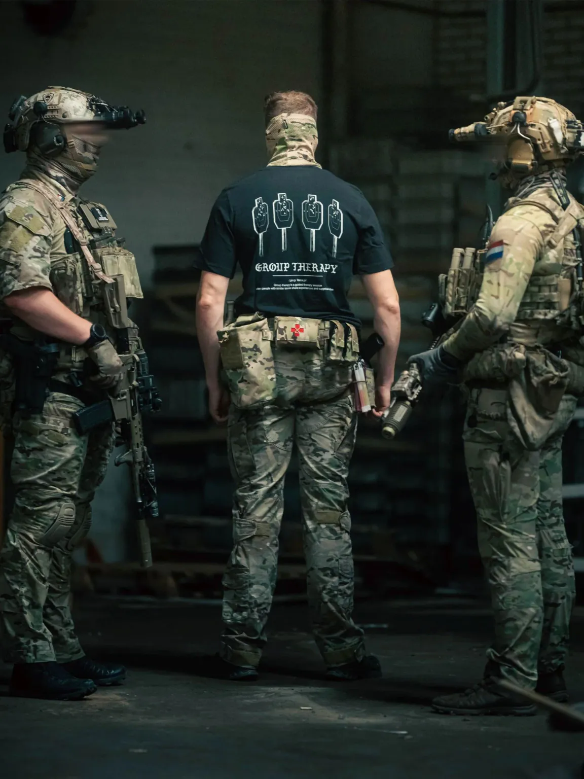 Black T-shirt from The Trace featuring Group Therapy design with four targets marked by tight bullet hole groupings