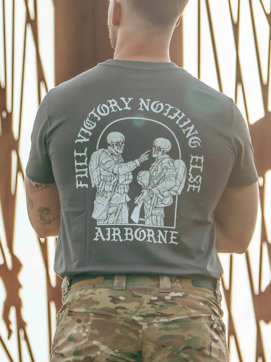 Tshirt featuring World War II design of two soldiers standing before a parachute jump