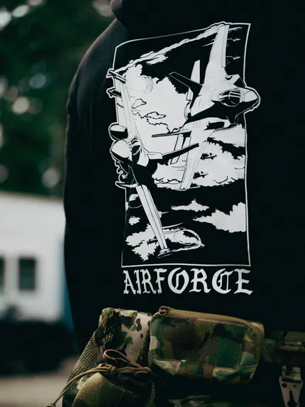 Black military hoodie with a sharp F-35 and F-16 fighter jet graphic, designed for a bold airforce look