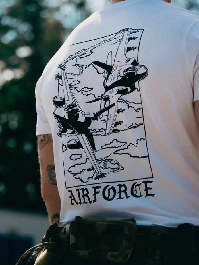 Lightweight t-shirt featuring an F-16 and F-35 in flight, paying tribute to speed, precision, and power