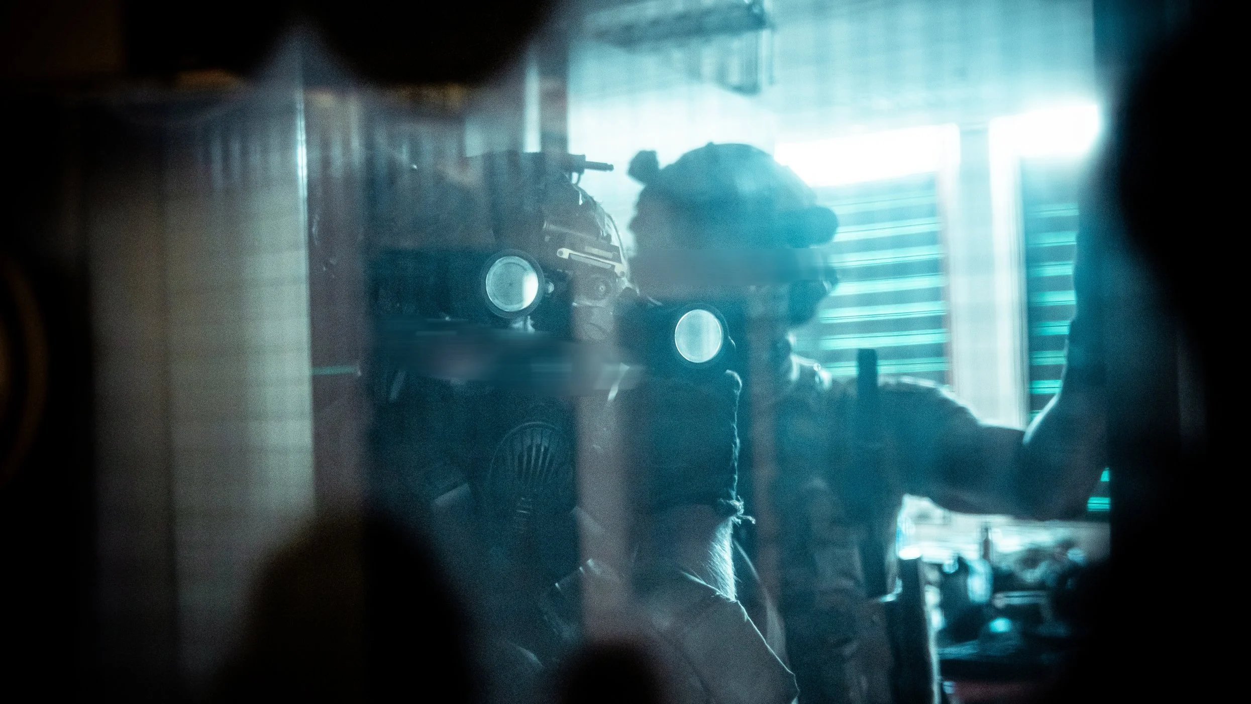 The Trace featuring dynamic photo of operators conducting close quarters battle