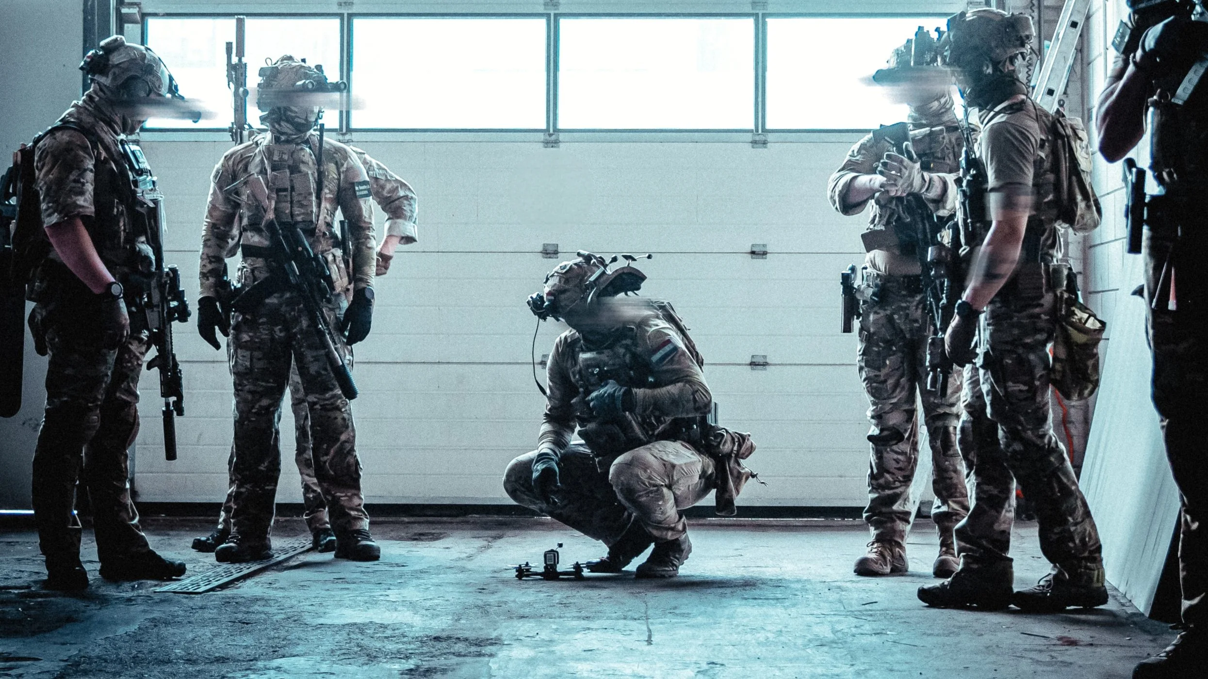 The Trace featuring dynamic photo of operators conducting close quarters battle