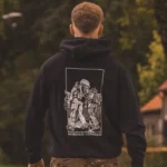 black hoodie from The Trace featuring design of two soldiers marching in the Nijmegen Four Days Marches