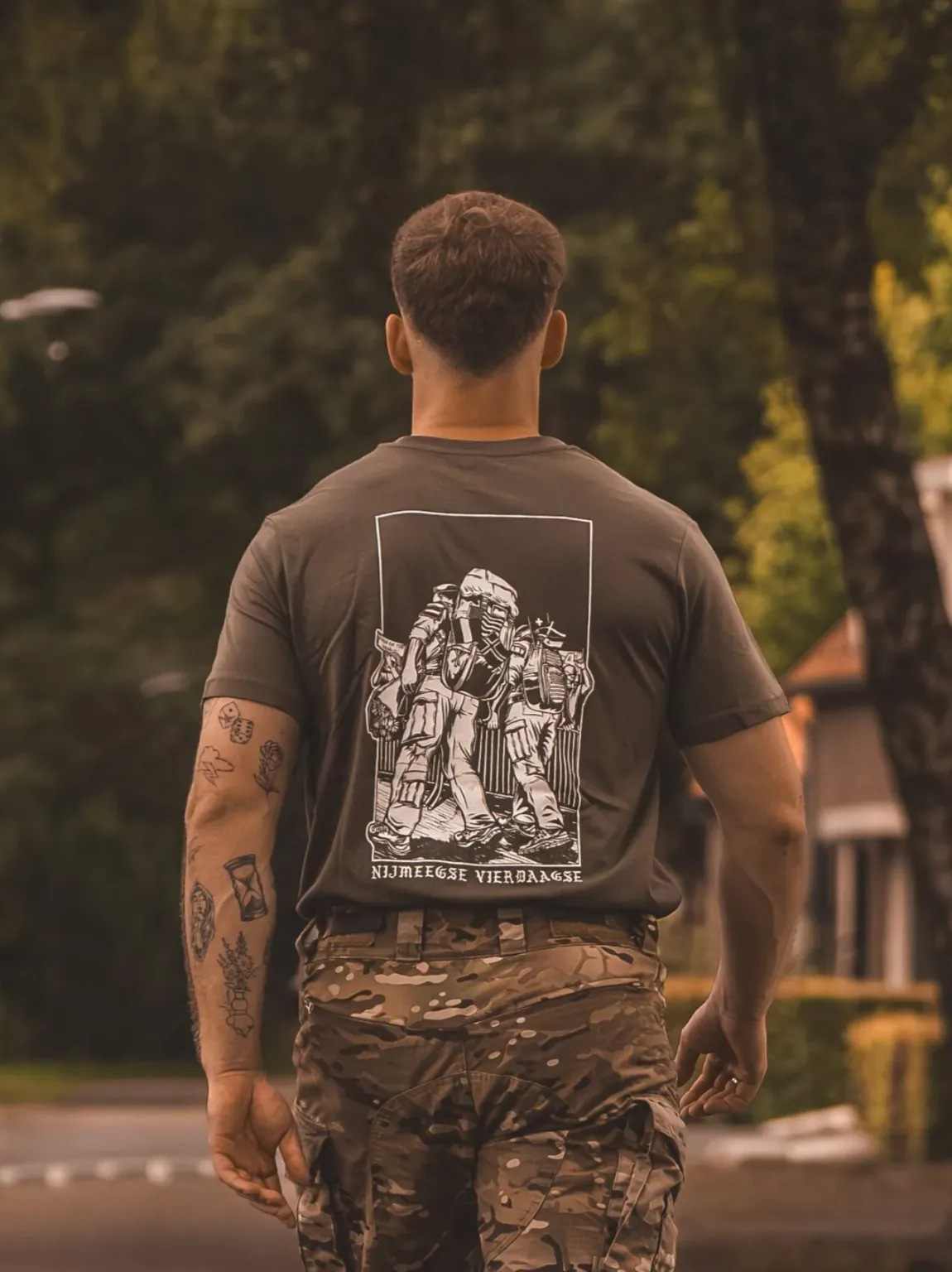 20240707_123329-e1753363058432 olive T-shirt from The Trace featuring design of two soldiers marching in the Nijmegen Four Days Marches