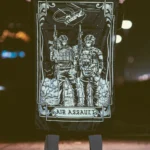 the trace apparel collection featuring 2 air assault operators standing in front of a chinook