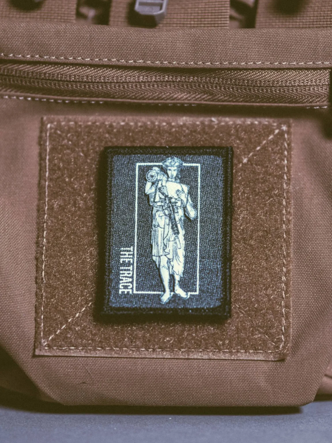 At4-statue-patch-edit_1 the trace apparel collection patch featuring a woman holding a anti tank weapon