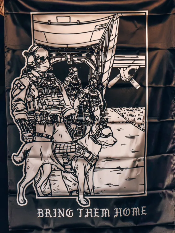 flag from The Trace featuring k9 and his doghandler on a rescue mission by c130.