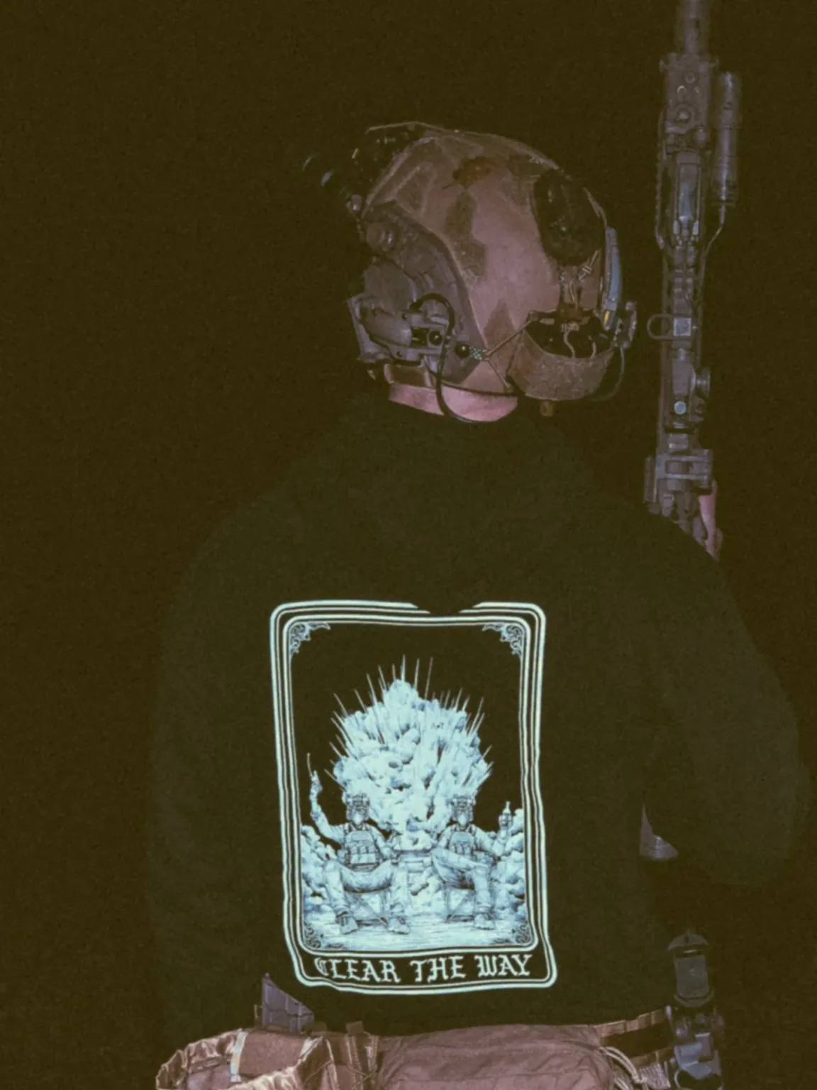 Clear-the-way-black-hoodie the trace apparel collection with 2 guys sitting in front of a explosing because they are part of the eod
