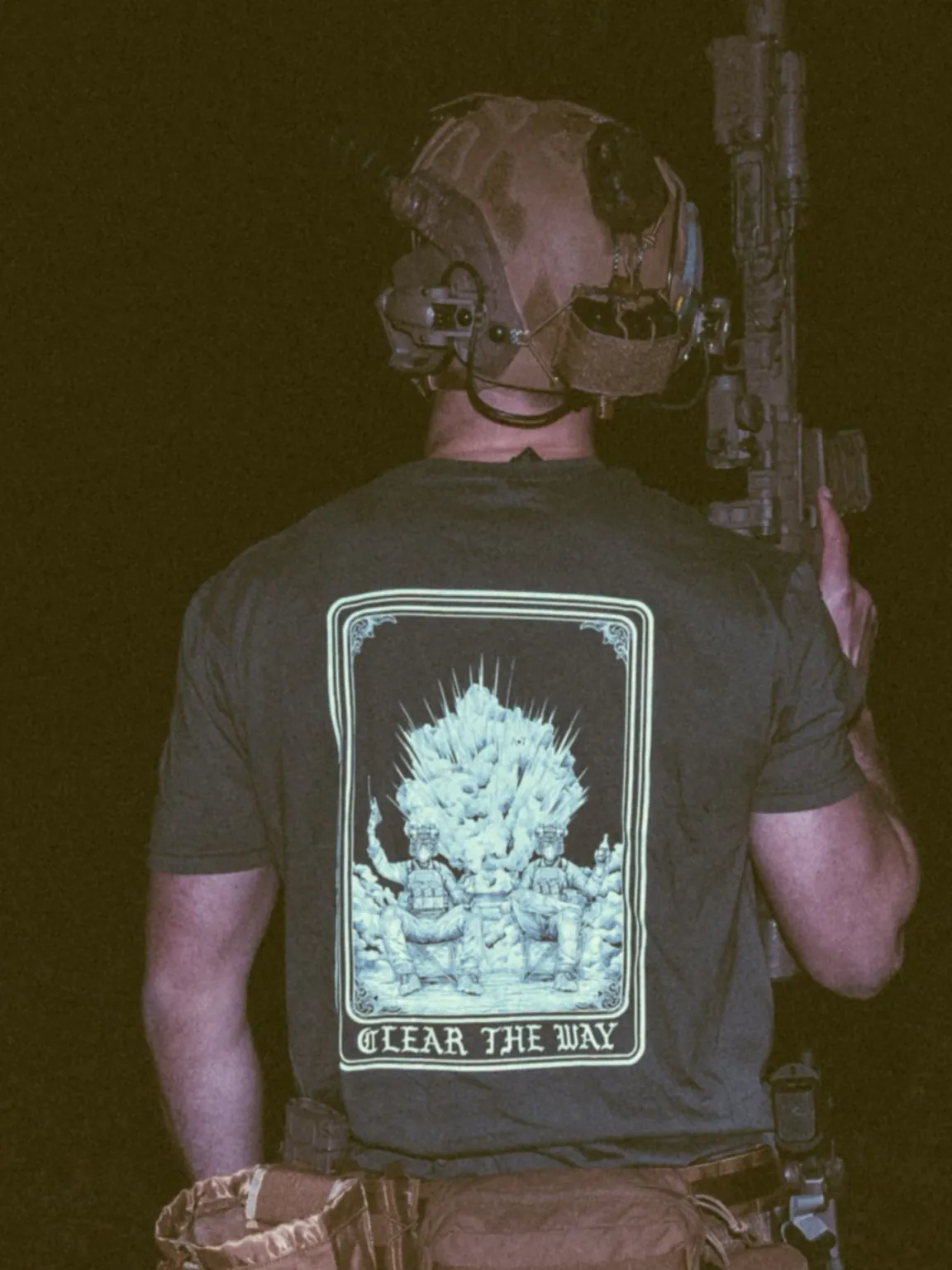 Clear-the-way-charcoal-shirt the trace apparel collection with 2 guys sitting in front of a explosing because they are part of the eod