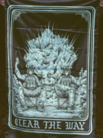 the trace apparel collection with 2 guys sitting in front of a explosing because they are part of the eod