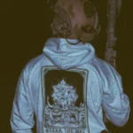 the trace apparel collection with 2 guys sitting in front of a explosing because they are part of the eod