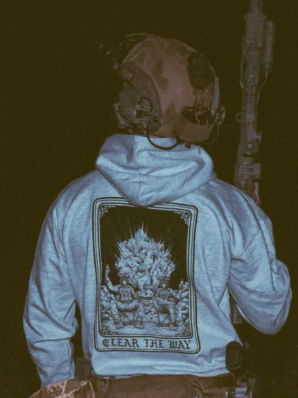 the trace apparel collection with 2 guys sitting in front of a explosing because they are part of the eod