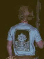 the trace apparel collection with 2 guys sitting in front of a explosing because they are part of the eod