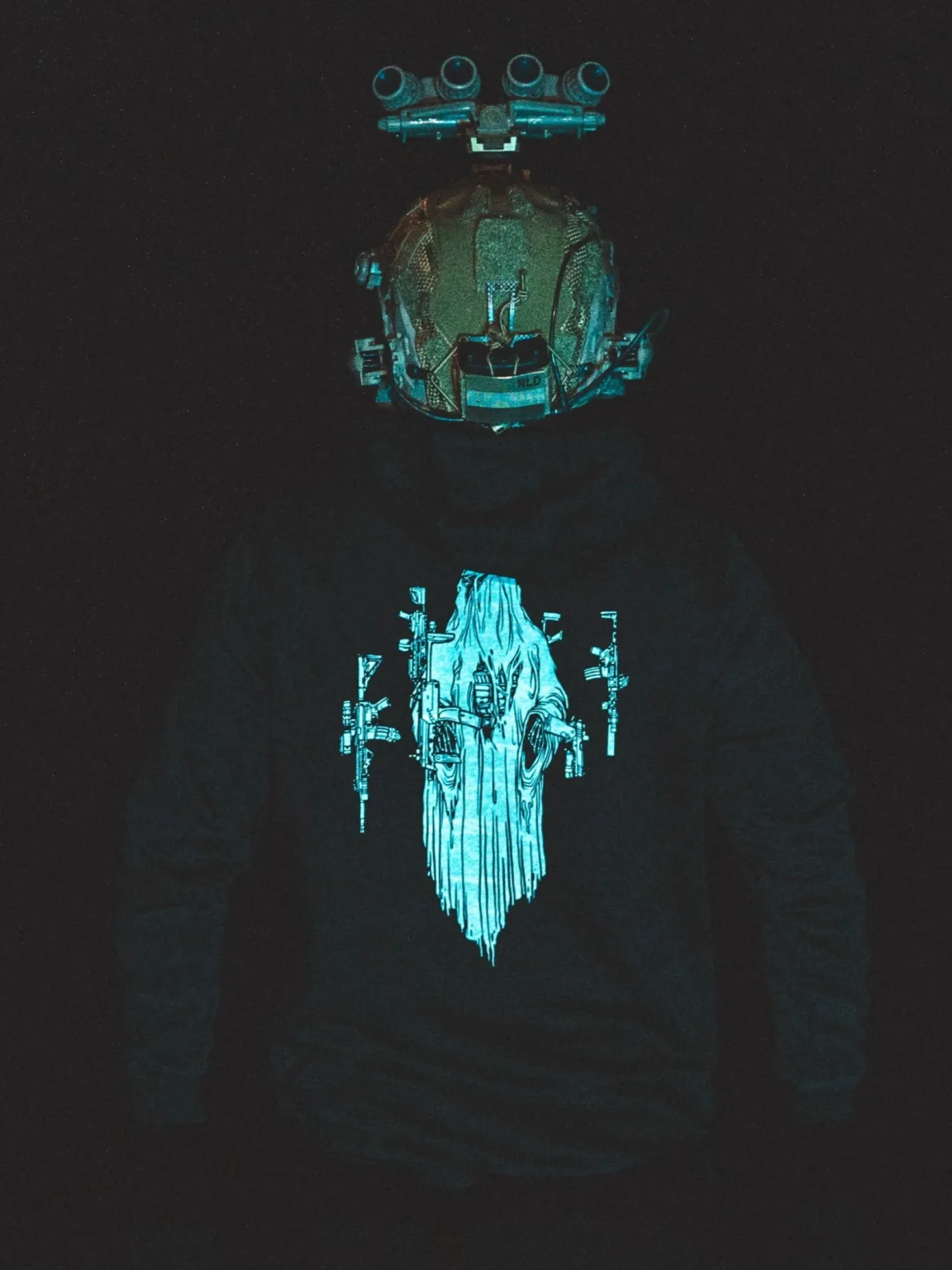 Halloween-Ghost-Hoodie the trace halloween collection featuring a ghost with hovering weapons around him