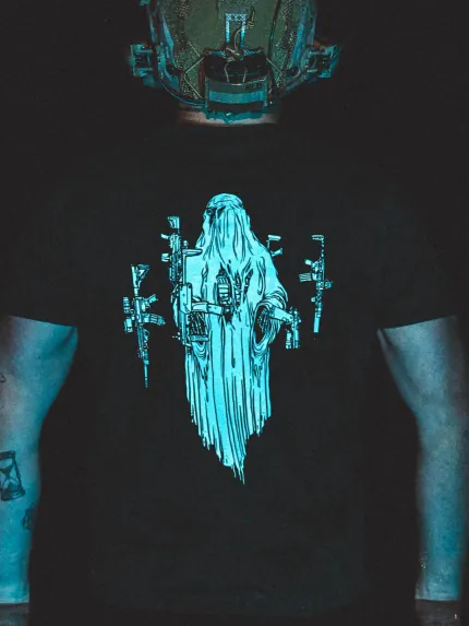 Halloween Ghost Tee by The Trace, close-up shot at night under blue light, the real print is white