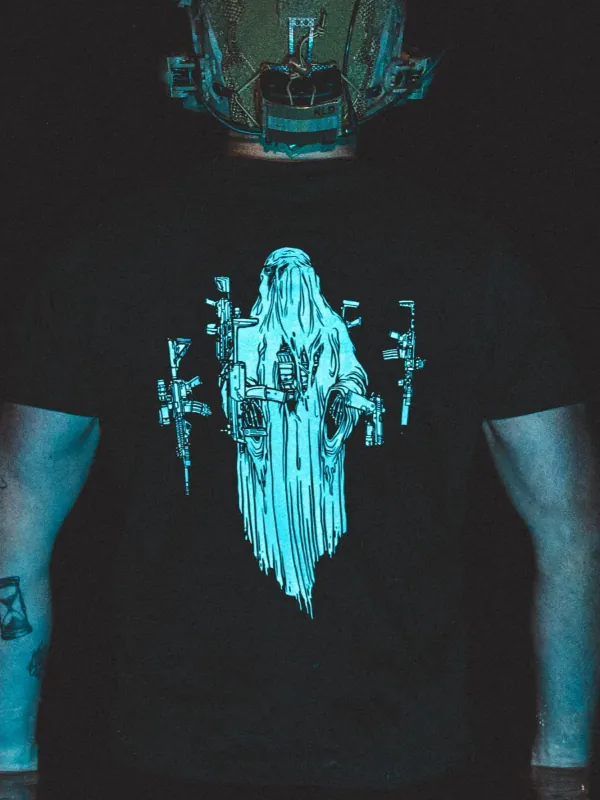 Halloween Ghost Tee by The Trace, close-up shot at night under blue light, the real print is white