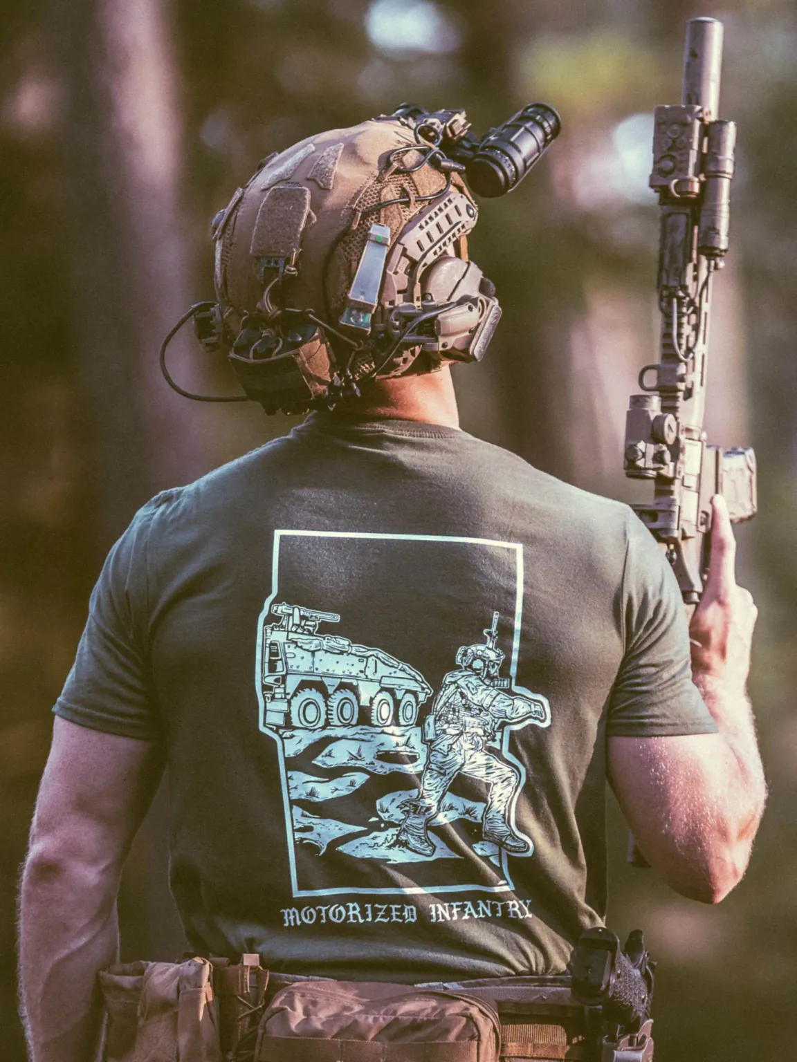 Motorized-infantry-shirt-olive the trace apparel collection featuring guys fighting alongside a military boxer vehicle