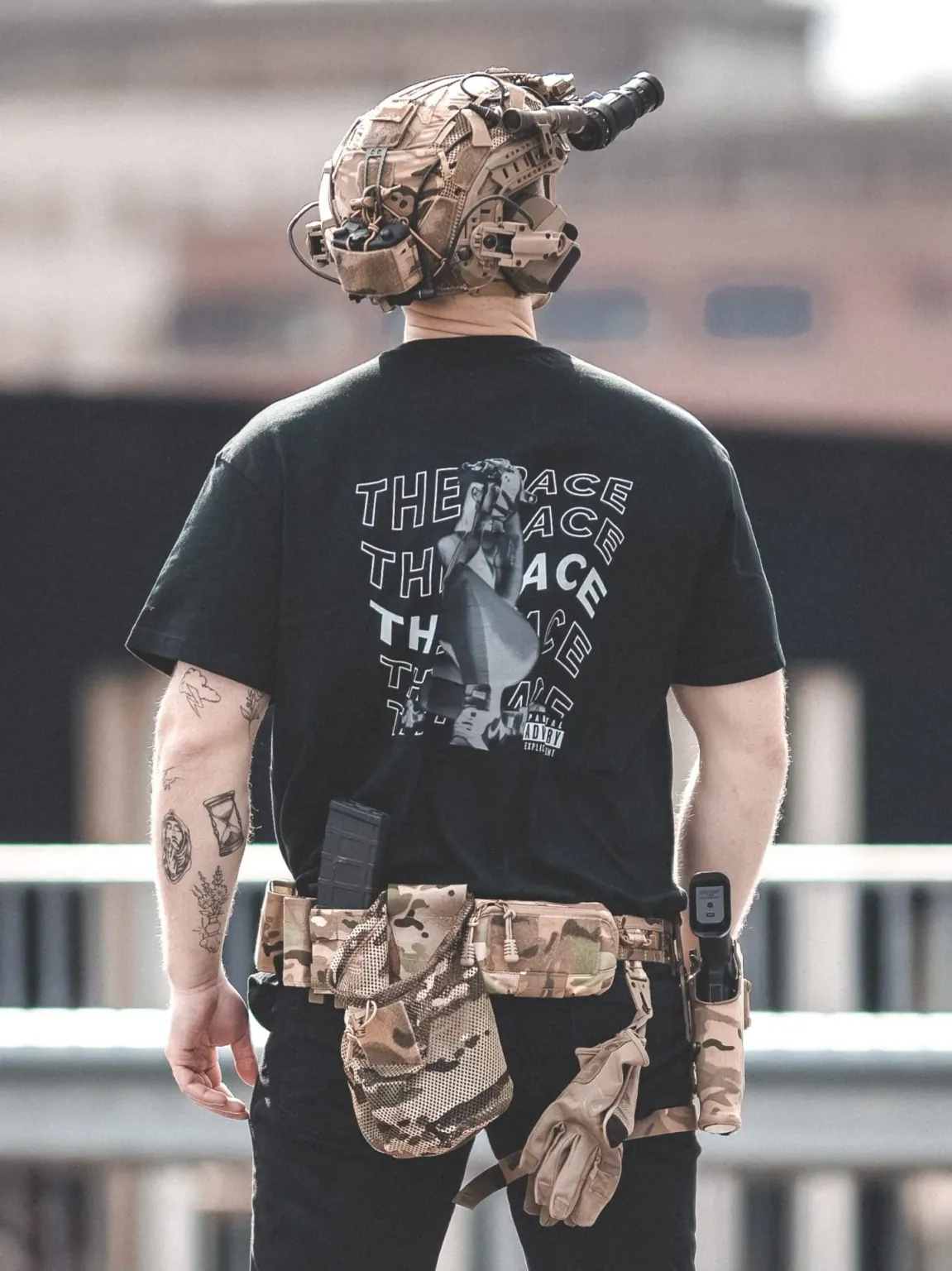 Oversized-white-hot-black-scaled-1-e1753362259409 the trace apparel collection featuring one of their cool designs showcasing a woman with military helmet