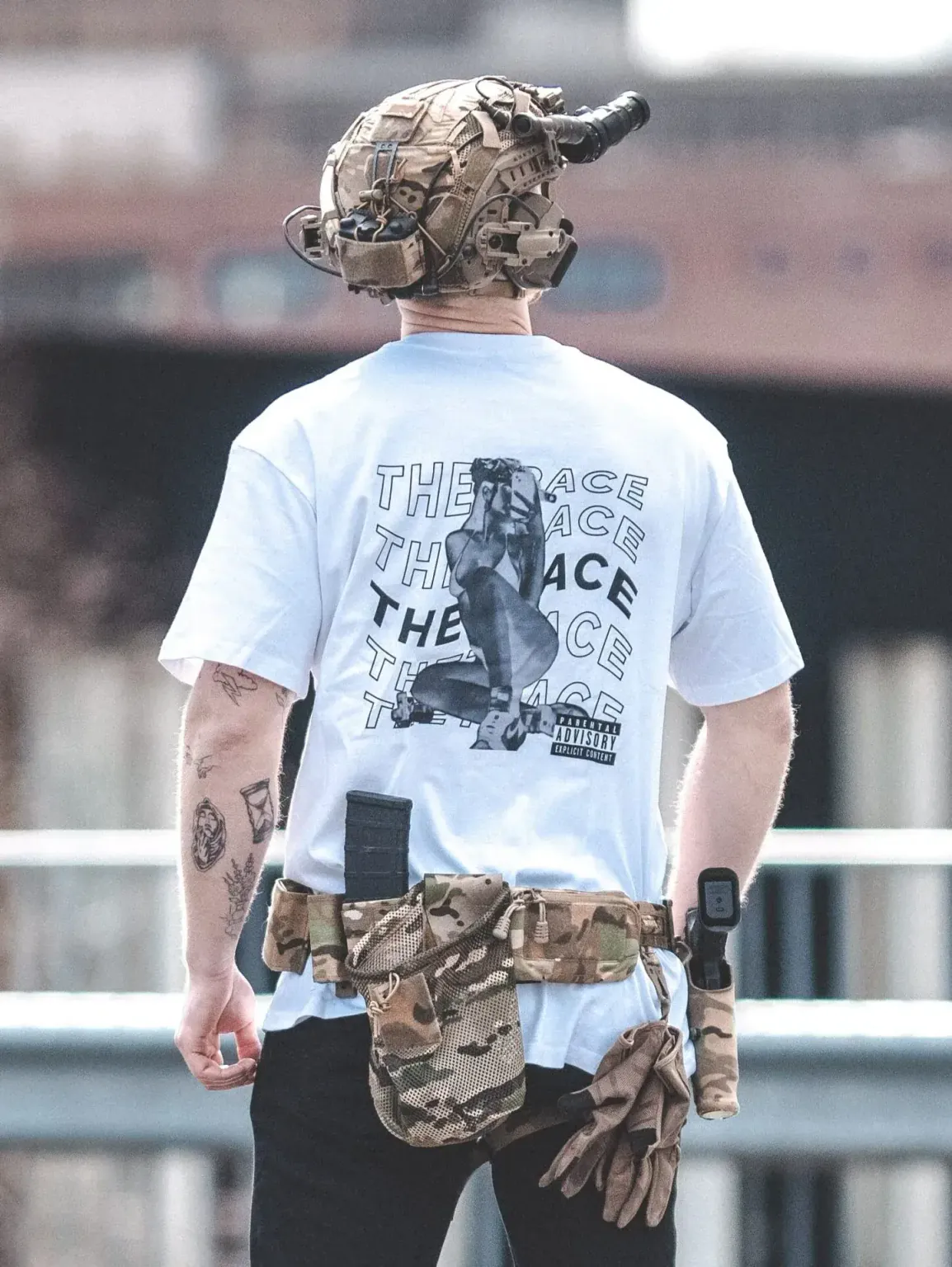 Oversized-white-hot-white-scaled-1-e1753362183361 the trace apparel collection featuring one of their cool designs showcasing a woman with military helmet