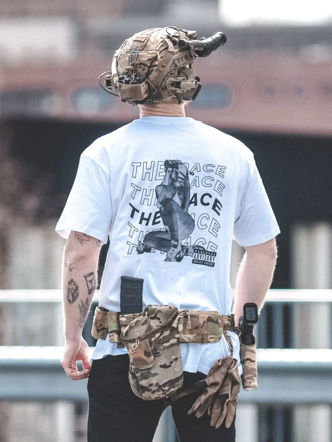 Oversized-white-hot-white-scaled-1-e1753362183361 the trace apparel collection featuring one of their cool designs showcasing a woman with military helmet