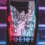 the trace apparel collection featuring two police cops standing in a street watching a riot