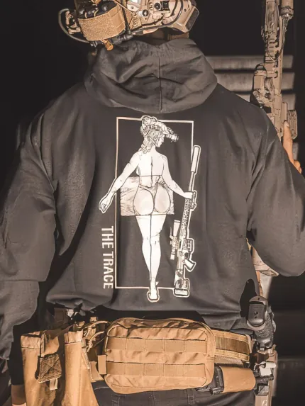black hoodie from The Trace featuring a girl carrying a sniper weapon.