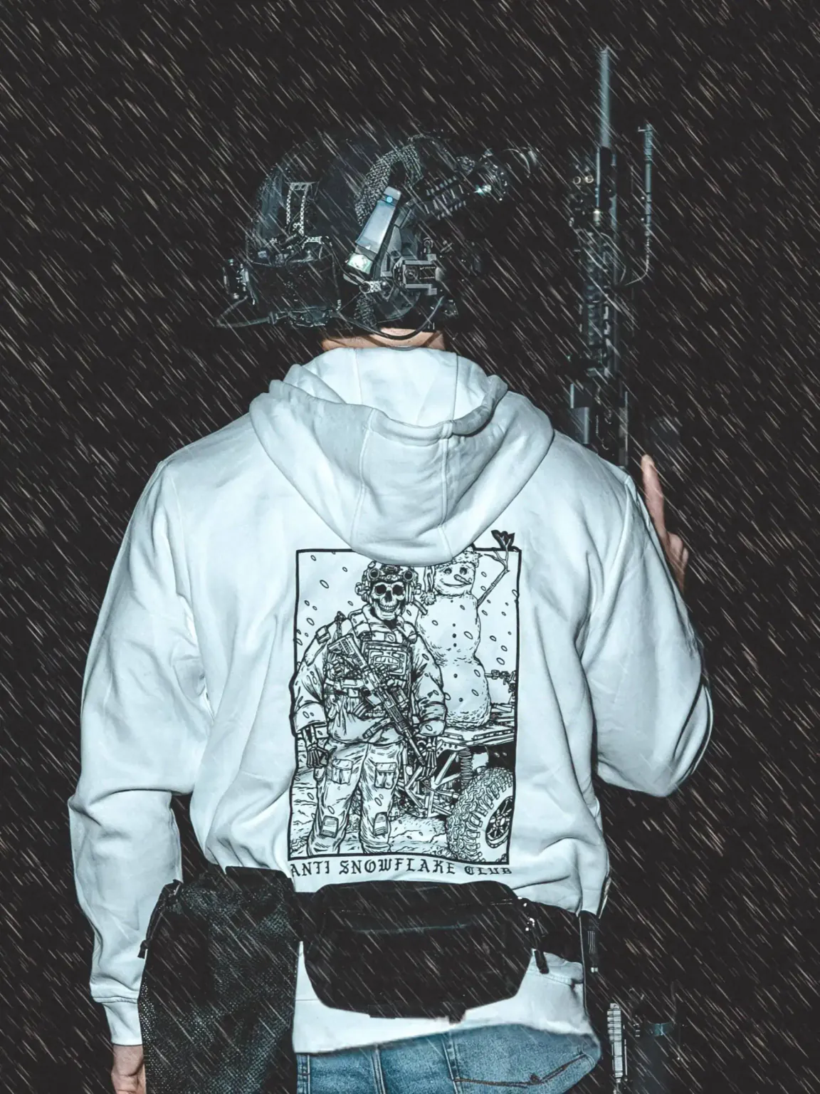 Snowflake-design-heather-grey-hoodie_2 the trace apparel collection featuring a design with a military operator standing next to a snowman with a text saying anti snow flake club