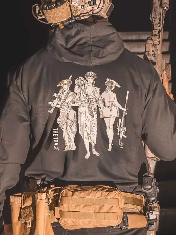 black hoodie from The Trace featuring 3 girls carrying a machinegun sniperrifle and anti tank weapon