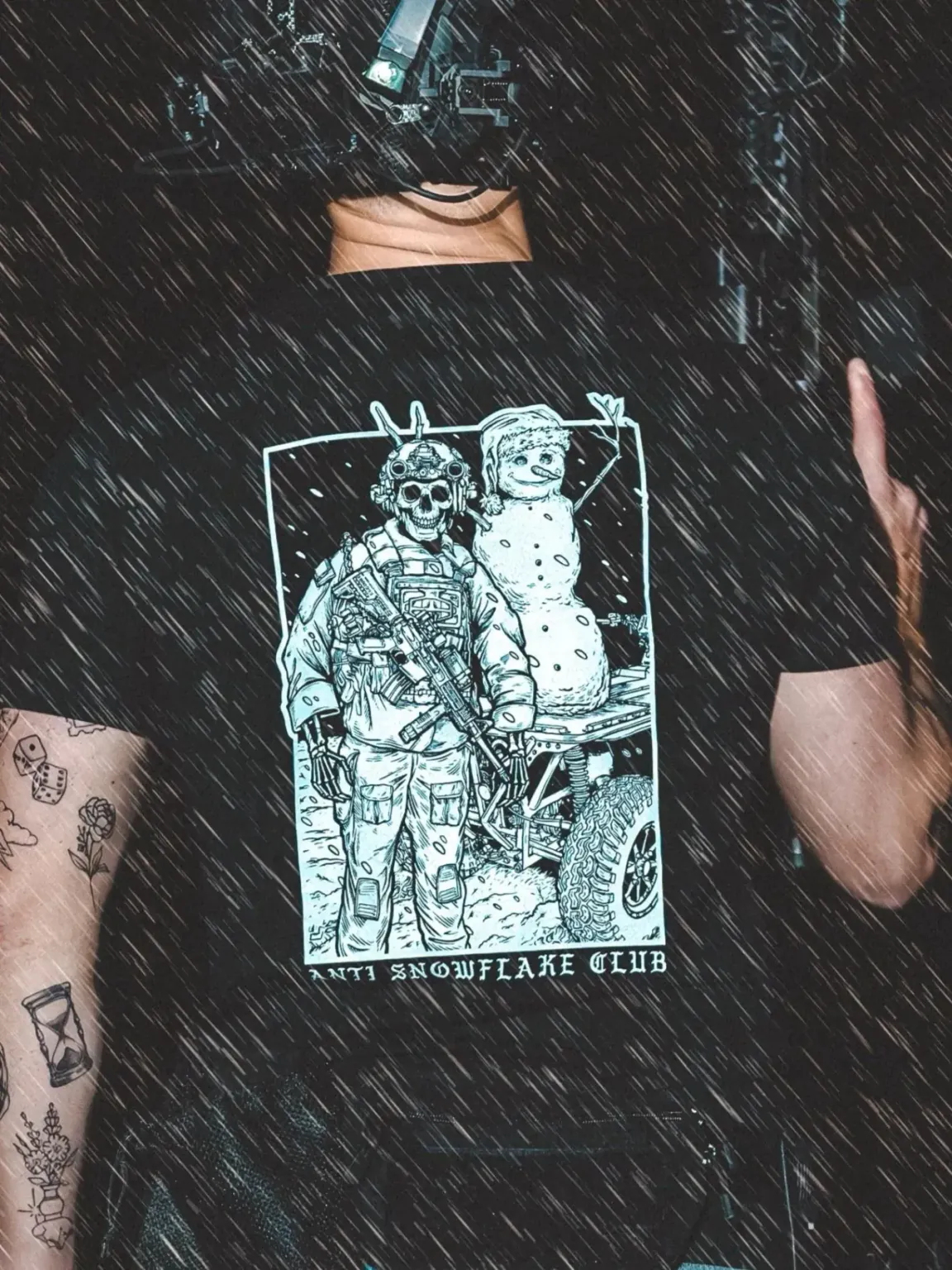 the trace apparel collection featuring a design with a military operator standing next to a snowman with a text saying anti snow flake club