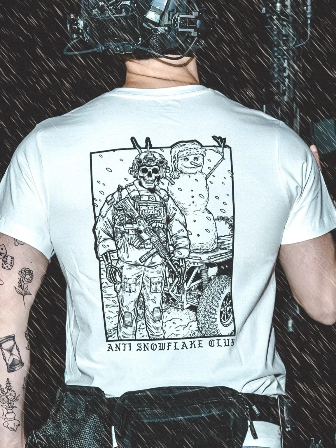 the trace apparel collection featuring a design with a military operator standing next to a snowman with a text saying anti snow flake club