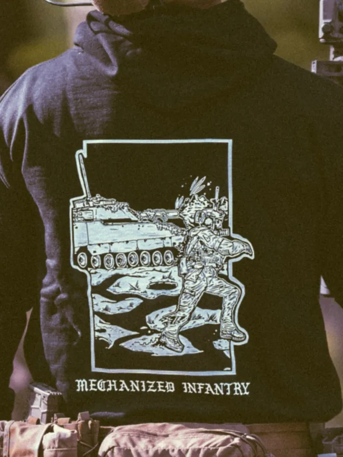 the trace apparel collection featuring guys fighting alongside a military cv90 vehicle