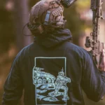 the trace apparel collection featuring guys fighting alongside a military boxer vehicle