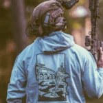 the trace apparel collection featuring guys fighting alongside a military boxer vehicle