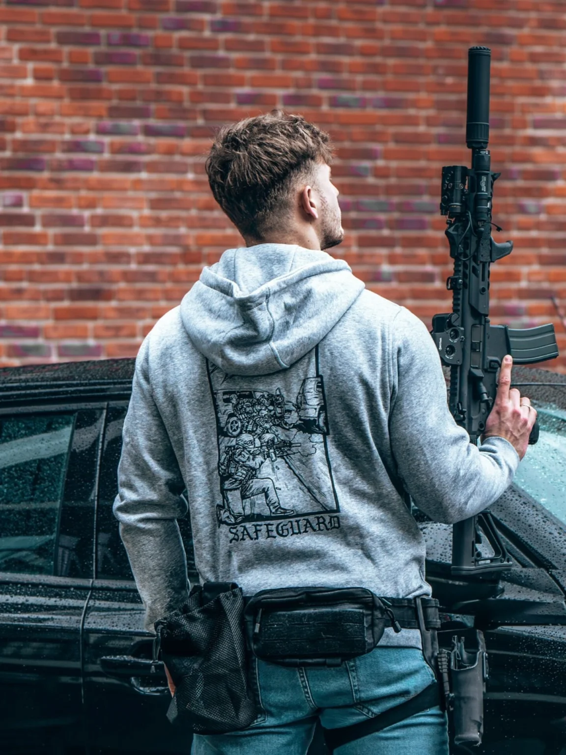 safeguard-heather-grey-hoodie_1 the trace apparel collection featuring a group of operators protecting a vip