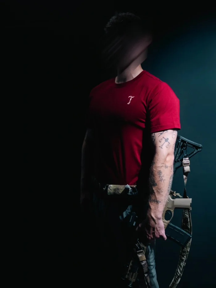 the trace mockup clothing featuring their T logo on the chest and a weapon on the hand