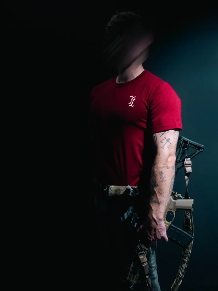 the trace mockup clothing featuring their T logo on the chest and a weapon on the hand